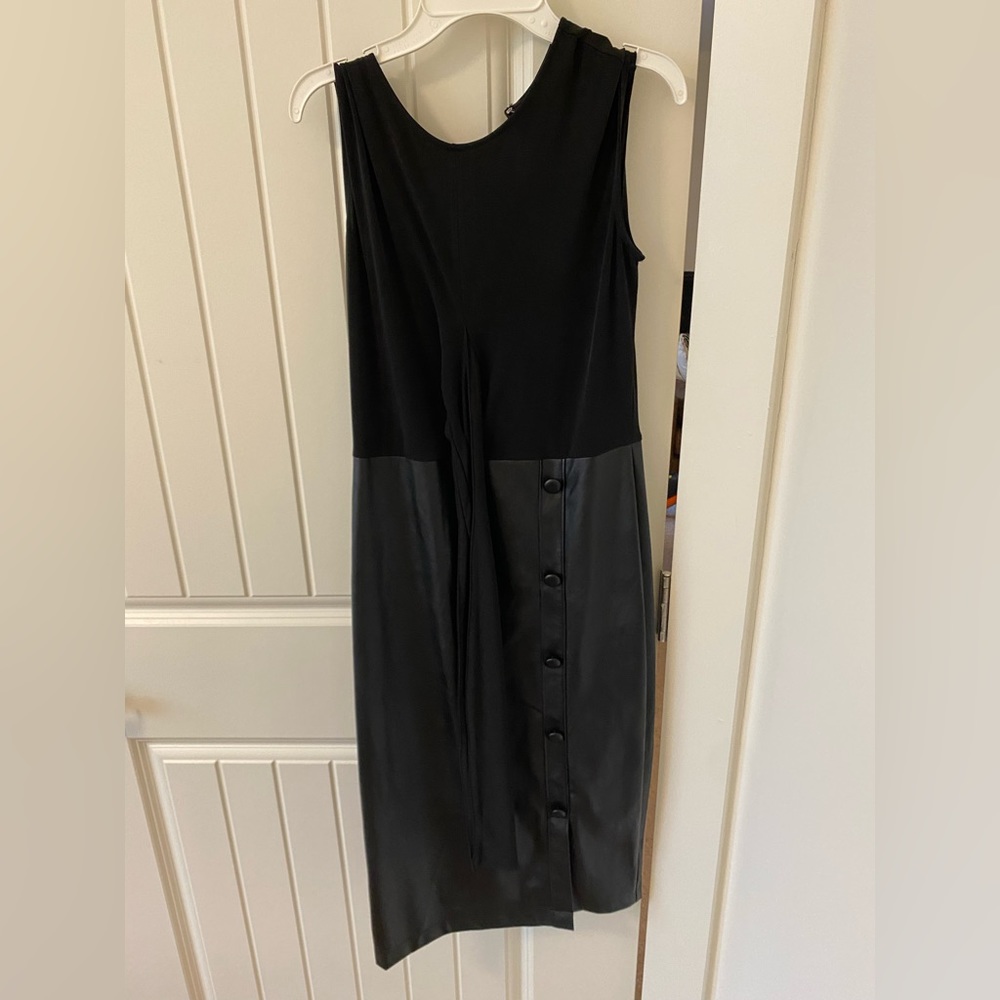 Black Form Fitting Tie Around waist… Faux Leather bottom. Size small. Worn once